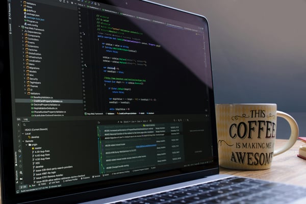 Photo by Daniil Komov: https://www.pexels.com/photo/laptop-with-coding-software-and-coffee-mug-34803973/